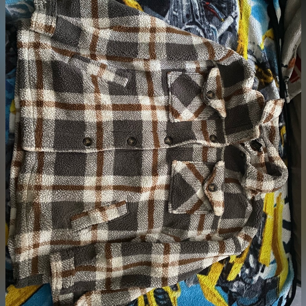 This product is 2X Teddy Jacket. The colours are white, grey, and brown.